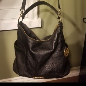 Michael Kors Satchel Black with matching wallet. You get both wallet and satchel